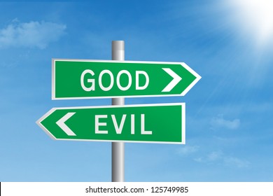 Green Road Sign Of Good Vs Evil Under Blue Sky