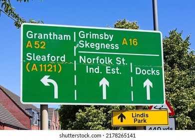 A Green Road Sign Showing Directions To Grantham, Sleaford, Grimsby And Skegness. BOSTON Lincolnshire UK. June 2022