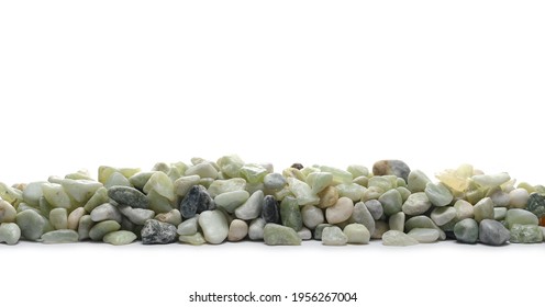 Green rocks, stone pile arranged to form fence isolated on white background