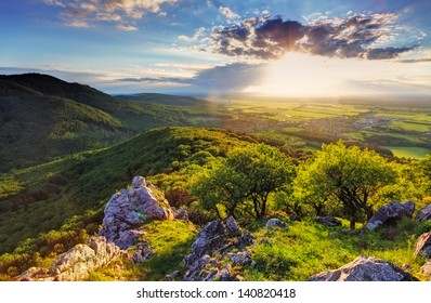 Green Rocky Moutain At Sunset