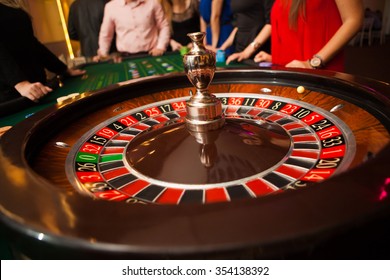 green roulette table with colored chips ready to play