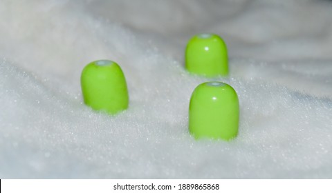Green round shape objects on white surface