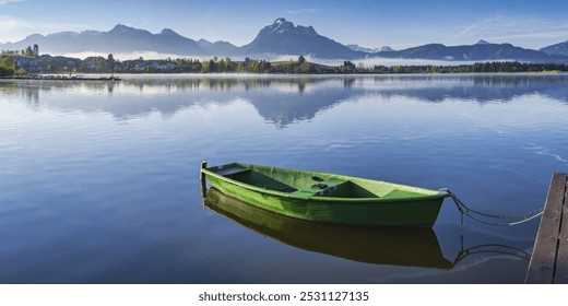 Green rowboat, lake Hopfensee, Hopfen am See, near Füssen, Ostallgäu, Allgäu, Bavaria, Germany, Europe - Powered by Shutterstock