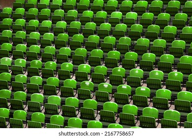 Green Rows Of Chairs At An Outdoor Concert Venue. Audience Seats.