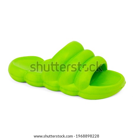 Green rubber slipper isolated on white background