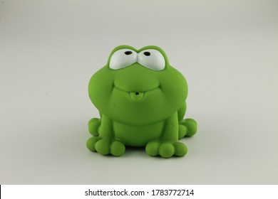 Green Rubber Toy Frog Isolated On A White Background