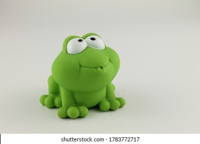 Green Rubber Toy Frog Isolated On A White Background