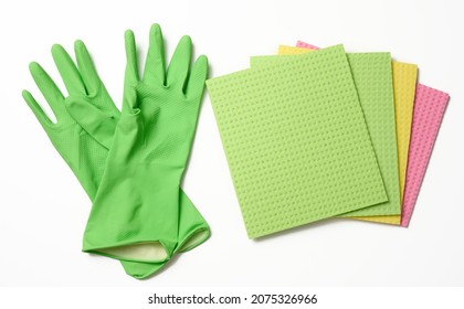 Green Rug, Rubber Gloves For Cleaning On A White Background, Flat Lay.