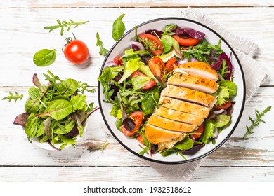 Green Salad With Baked Chicken Breast At White Kitchen Table. Healthy Food, Clean Eating Concept. Top View Image.