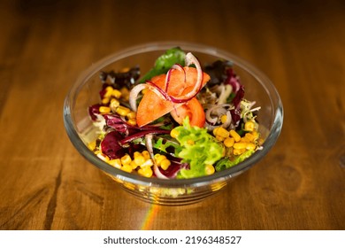 Green Salad In A Big Bowl On A Wooden Table