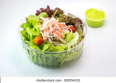 Green Salad With Crab Stick And Wasabi Dressing In Plastic Box

