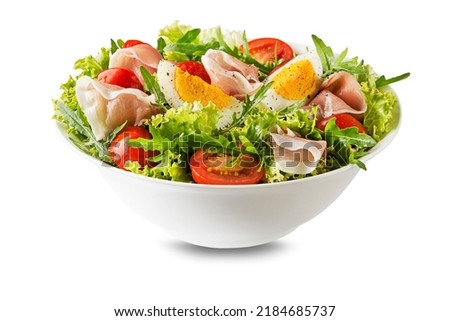 Green Salad with prosciutto, egg, arugula and tomato isolated on white background