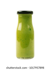 Green Sauce Condiment In A Glass Bottle Jar, Isolated Over The White Background