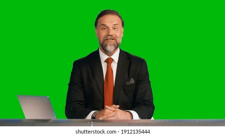 Green Screen Background: Live News Studio with Professional Male Anchor Reporting on the Events of the Day. Television Channel Newsroom Concept. Chroma Key Template Background