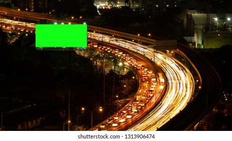 Green Screen Billboard With Traffic Jam On Road At Highway For Advertising In Urban City, Bangkok , Thailand At Night.