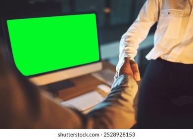 Green screen, computer and business people with handshake, night and partnership with b2b deal. Closeup, evening and employees with pc, mockup space and cooperation with project and collaboration - Powered by Shutterstock