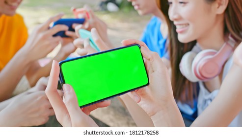 Green Screen Concept - Happy Young Asian Students Play Mobile Game On Campus