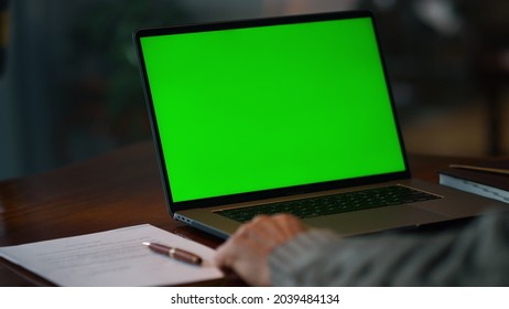 Green screen laptop computer closeup. Unknown senior man having video call at chroma key laptop screen at home. Unrecognizable old man making conference at mockup laptop - Powered by Shutterstock