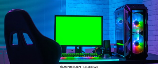 Green Screen Monitor With Powerful Personal Computer For E Cyber Sport Gamer On The Table At Home