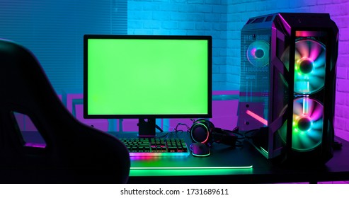 Green Screen Monitor With Powerful Personal Computer For E Cyber Sport Gamer On The Table At Home