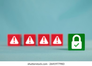 A green security padlock icon in focus, with red warning threat symbols blurred in the background. Concept for cybersecurity,data protection,firewall,potential threats and risks.,copyspace.
