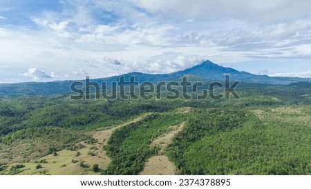 Green Seulawah mountains and beautiful sky clouds under blue sky, Aceh province, Indonesia
