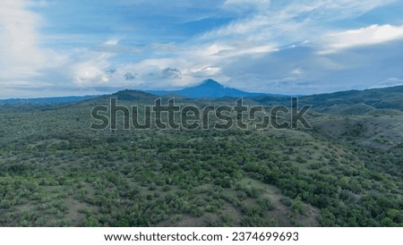 Green Seulawah mountains and beautiful sky clouds under blue sky, Aceh province, Indonesia