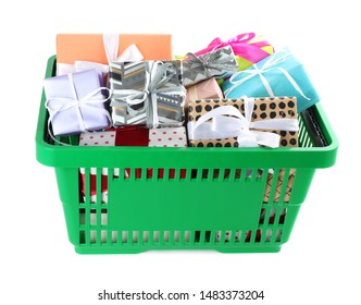 Green shopping basket with different gifts on white background
