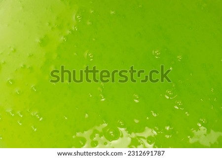 Green slime toy as a background. Top view. 
