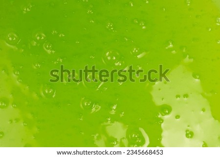 Green slime toy as a background. Top view. 