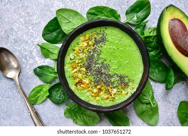 Green Smoothie Bowl On A Light Grey Slate, Stone Or Concrete Background.Top View.