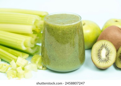 Green smoothie of celery, kiwi, green apple and spinach in a glass. - Powered by Shutterstock