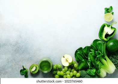 Green Smoothie In Glass Jar With Fresh Organic Green Vegetables And Fruits On Grey Background. Spring Diet, Healthy Raw Vegetarian, Vegan Concept, Detox Breakfast, Alkaline Clean Eating. Copy Space.