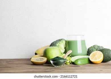 Green Smoothie In Glass, Spirulina Powder, Vegetables And Fruits On Wooden Background. Healthy, Raw, Vegan Diet Concept. Copy Space