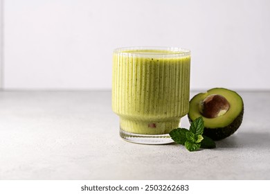 Green smoothie. Glasses of green avocado, kiwi, mint, detox smoothie. - Powered by Shutterstock