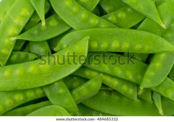 green snow pea pods\
background