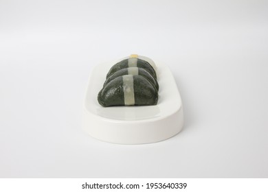 green Song pyeon which is Korean rice cake on a white plate