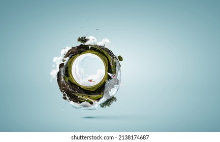 Green sphere landscape with grass and clear water . Mixed media - Shutterstock ID 2138174687