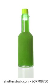 Green Spicy Sauce In A Little Bottle Isolated On A White Background