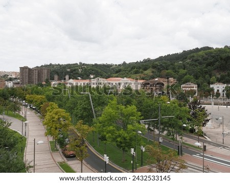 Green square in European BILBAO city at Biscay province in SPAIN, cloudy sky in 2019 warm sunny summer day on September.