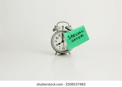 A green sticky note with "SPECIAL OFFER" attached to an alarm clock - Powered by Shutterstock