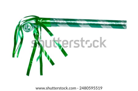 Green streamers below a silver and green noisemaker ideal for celebrations.