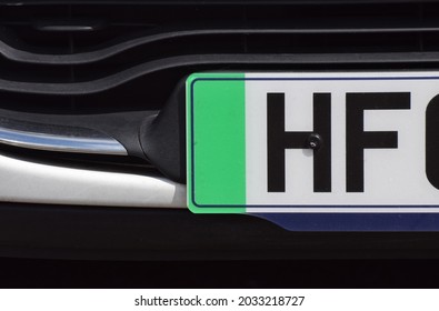 The green strip on a British car front number plate that denotes the car is a zero emissions vehicle