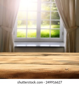 Green Sunny View Of Garden In Window And Desk Space Of Wood 