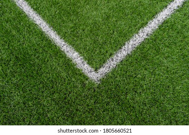 Green Synthetic Grass Sports Field With White Line Shot From Above. Soccer, Rugby, Football, Baseball Sport Concept