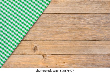 Green Table Cloth Covered On Wood Background, Top View, Copy Space.