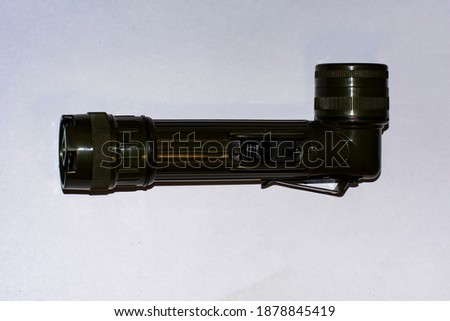 green tactical flashlight with mount
