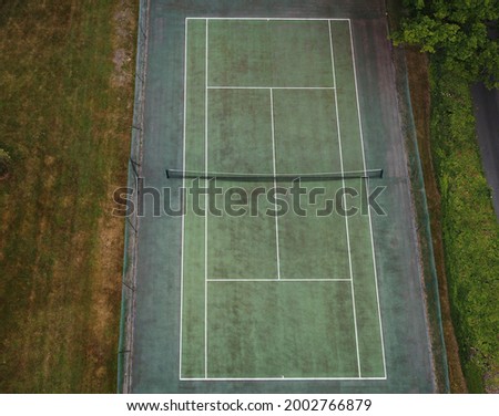 green tarmac tennis court from above