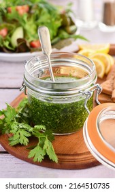 Green tasty herb sauce marinade from cilantro, parsley, oil, traditional seasoning for salad dressing - Shutterstock ID 2164510735