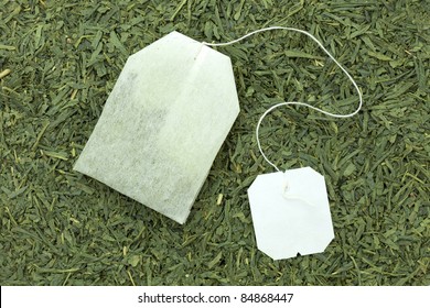 Green Tea Bag On Tea Leaves